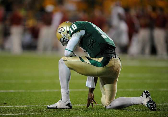 Nov 19, 2011; Waco, TX, USA; Baylor Bears quarterback Robert Griffin III (10) celebrates after throwing a touchdown against the Oklahoma Sooners during the third quarter at Floyd Casey Stadium. The Bears upset the Sooners 45-38. Mandatory Credit: Jerome Miron-USA TODAY Sports